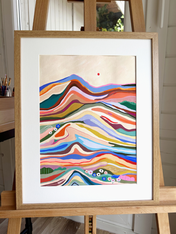 colorful abstract painting of a mountain with a red sun and sandy sky