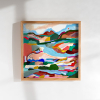 A colorful abstract landscape painting by Marina Ester Castaldo