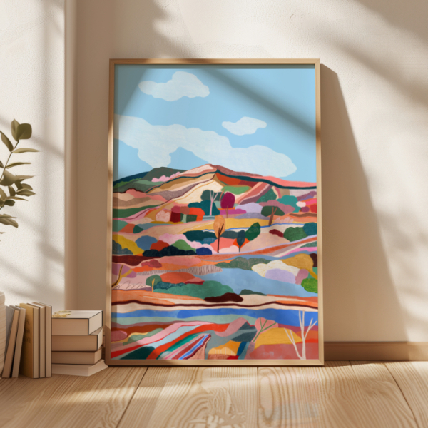 A colorful mountain landscape with trees and blue sky